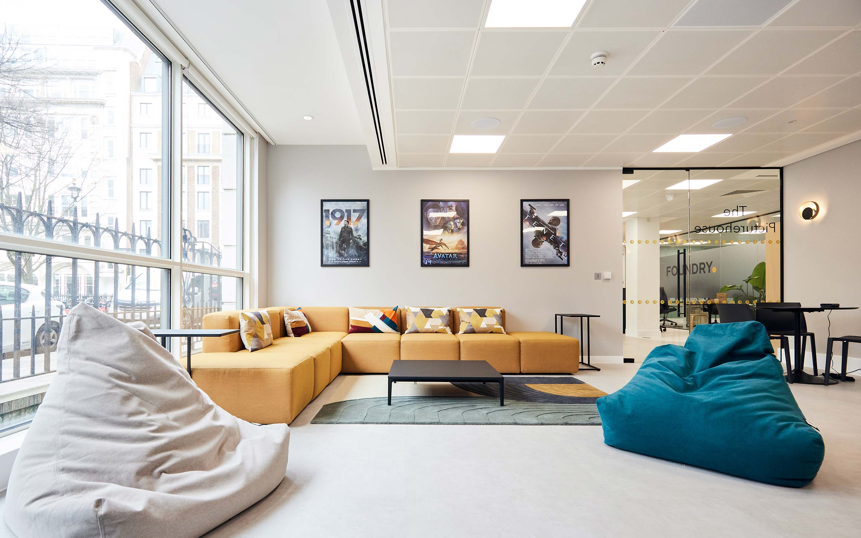 Office interior featuring bean bags and couches, creating a cosy and versatile breakout area for employees