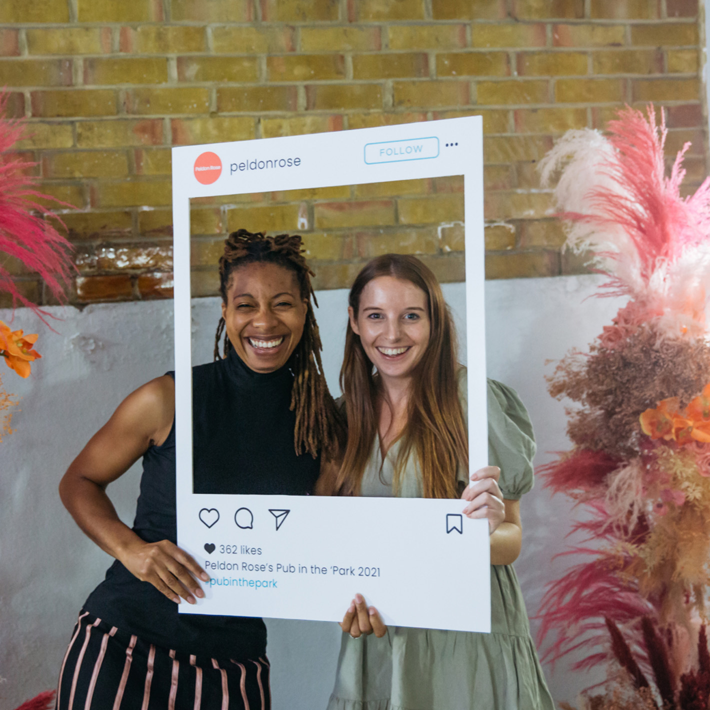 Two Peldon Rose employees at a social event