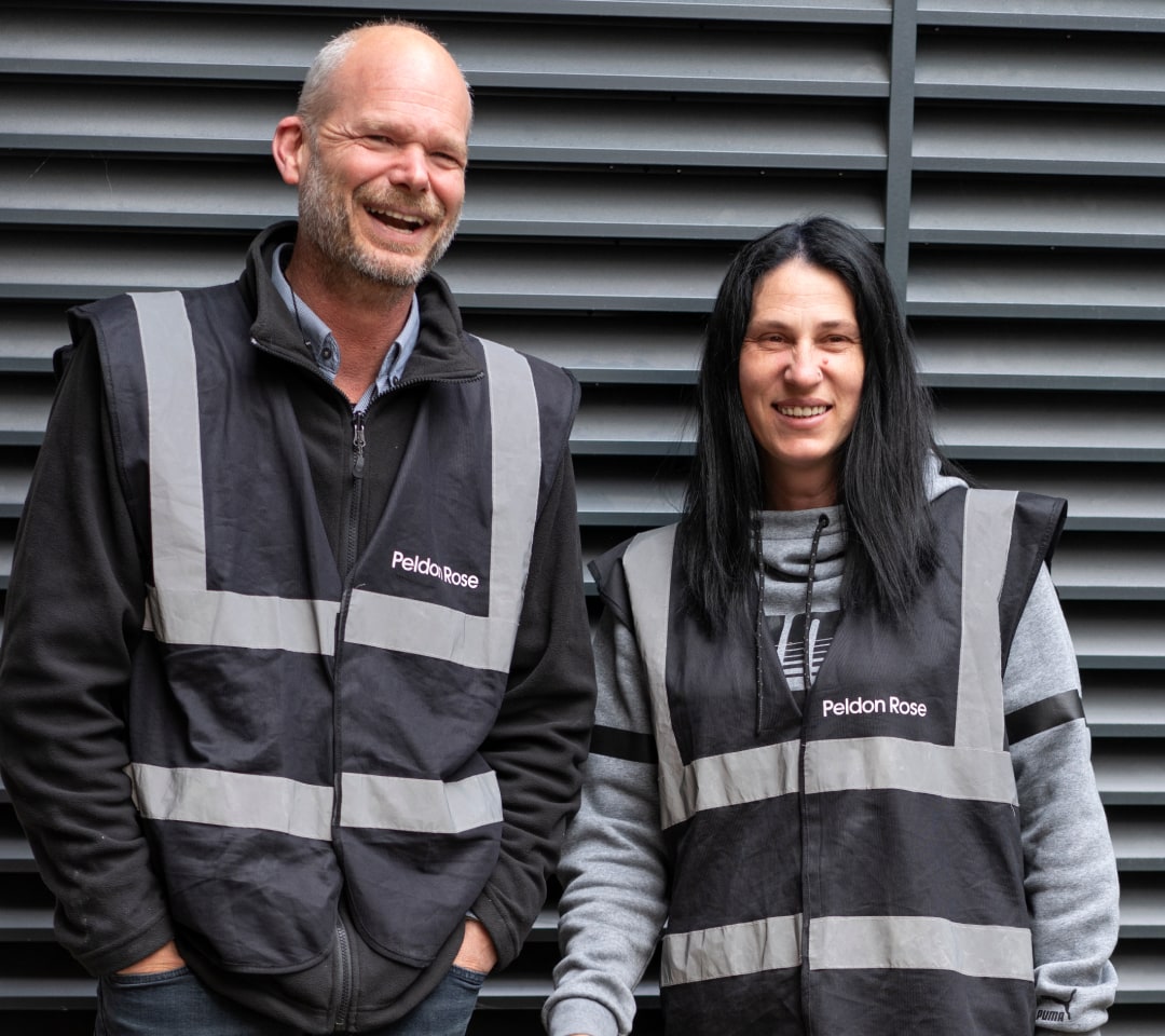 Two Peldon Rose colleagues in black safety vests