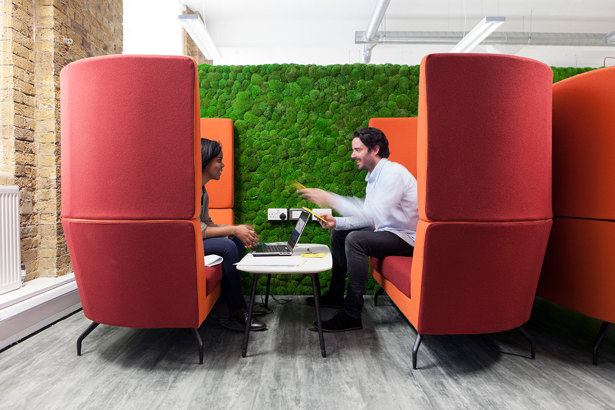 Two people having a meeting in a booth