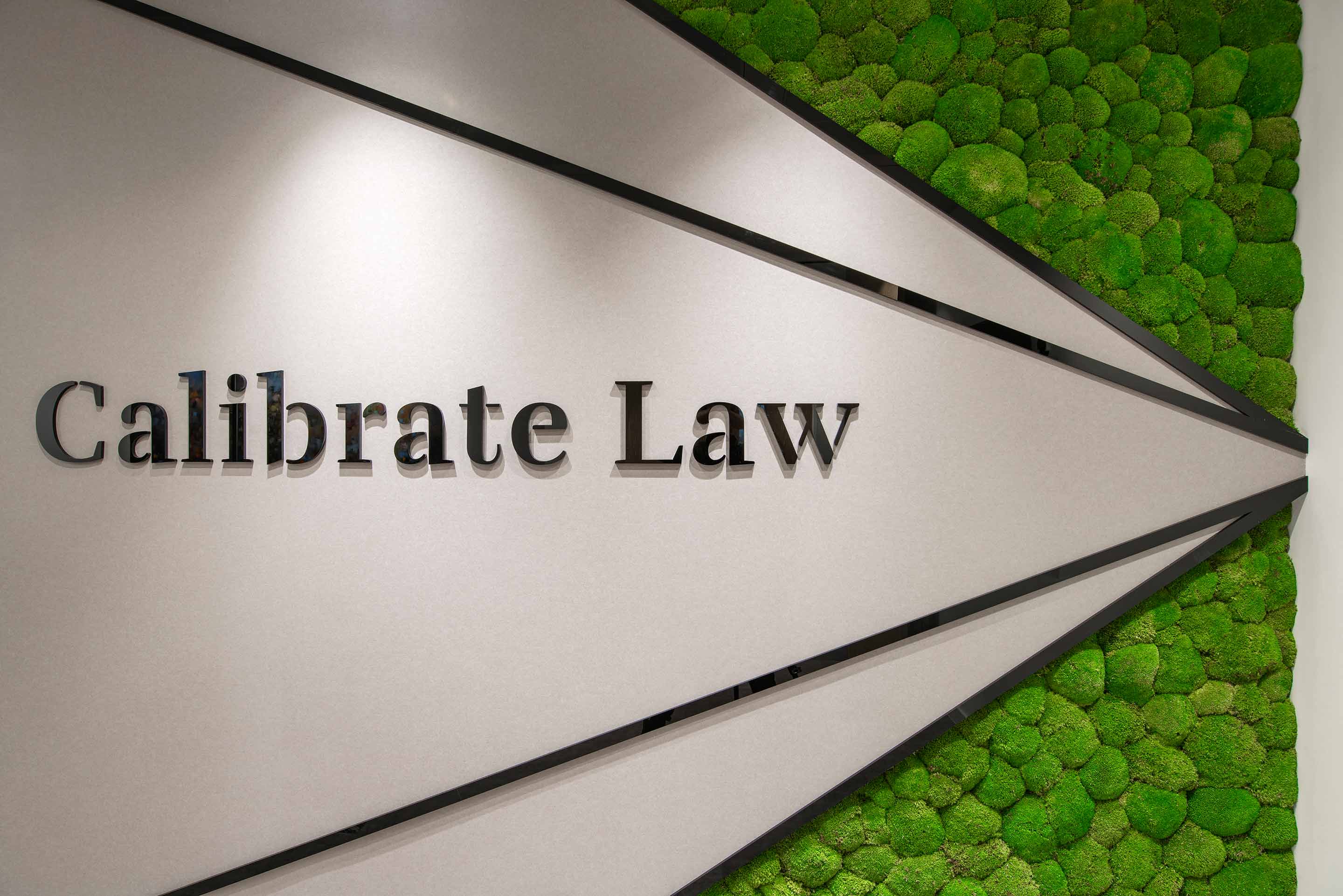 Manifestation of calibrate Law's logo featuring a live wall
