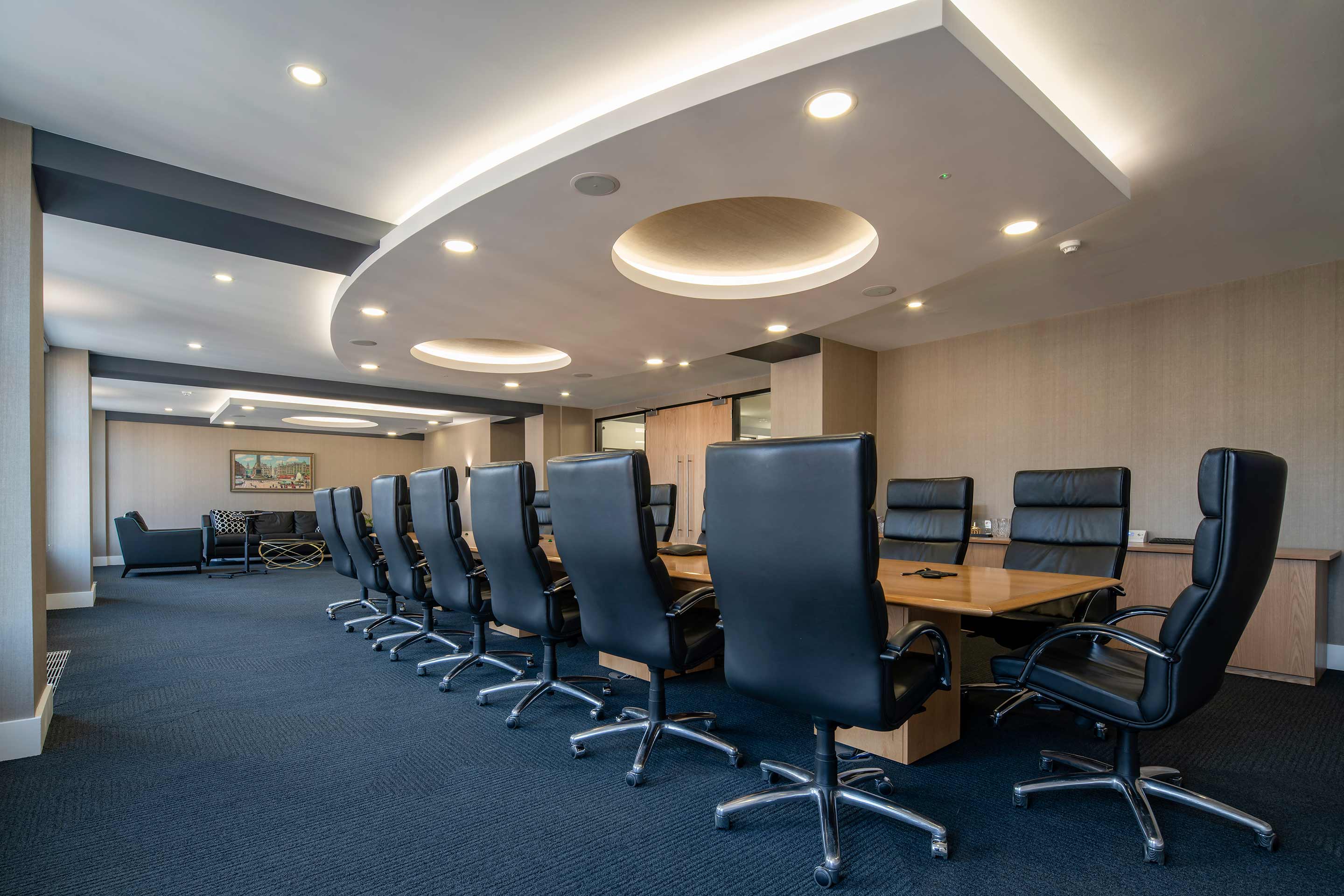 High backed leather chairs in a large boardroom