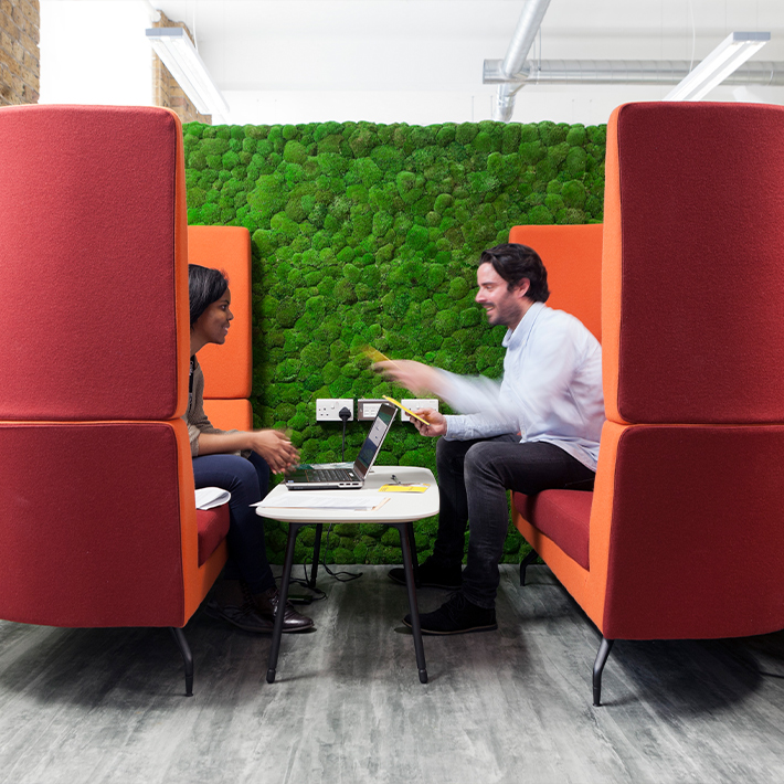 Biophilic live wall behind a collaboration booth