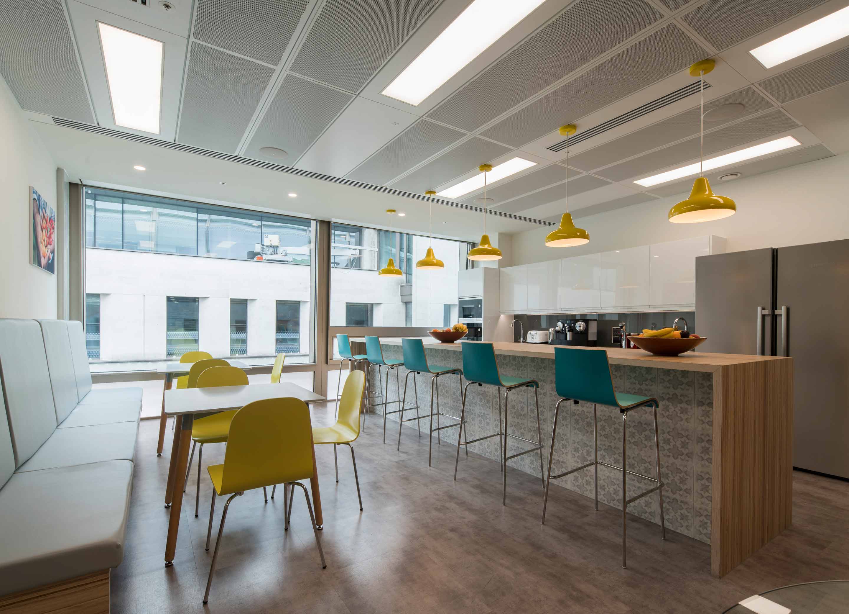 Large kitchen with a wooden breakfast bar