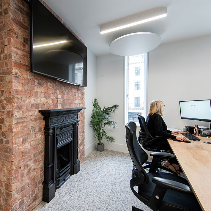 glenhawk desking next to brickwork and painted fireplace