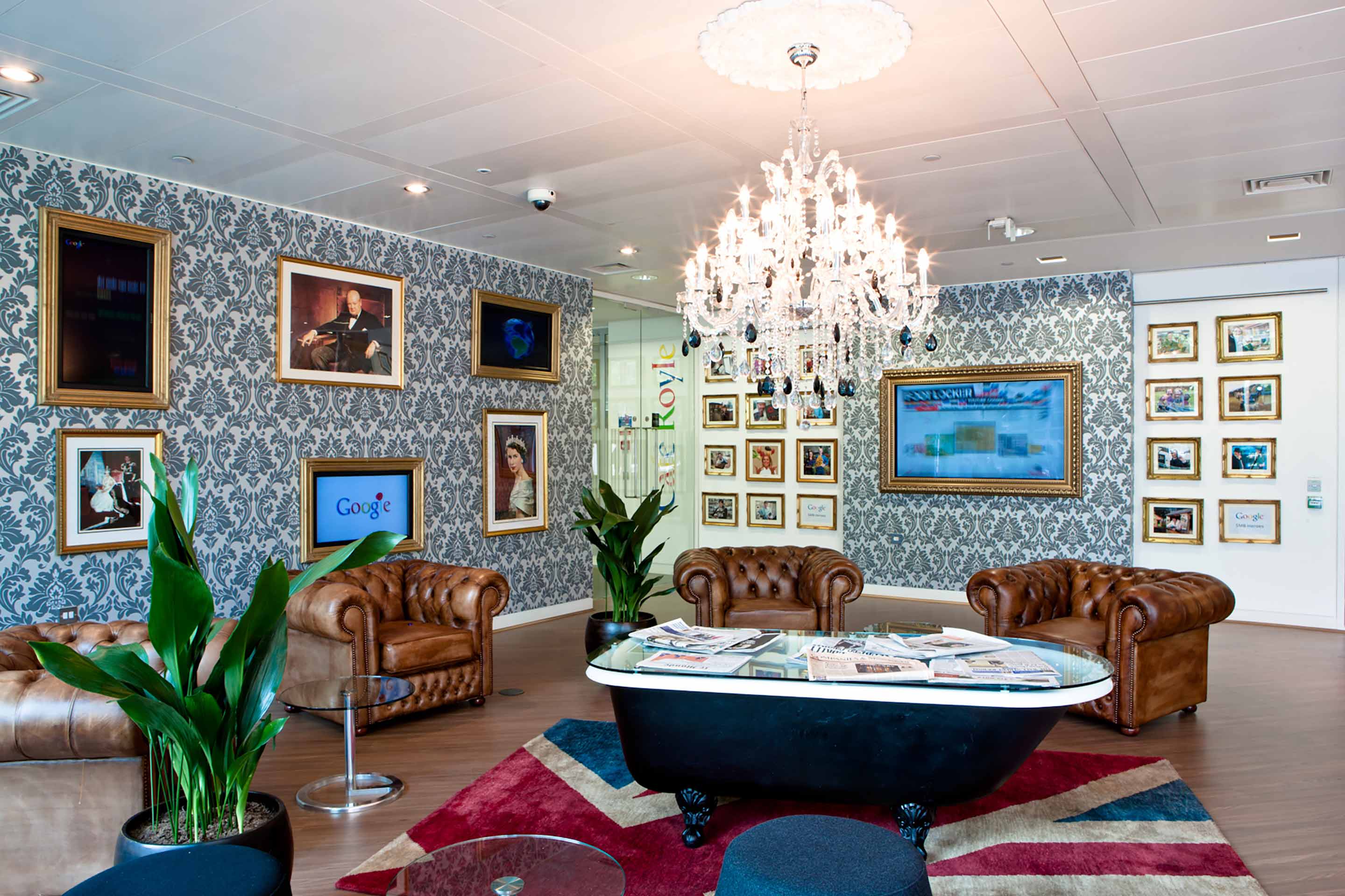 Large chandelier over leather chairs in Google's waiting area