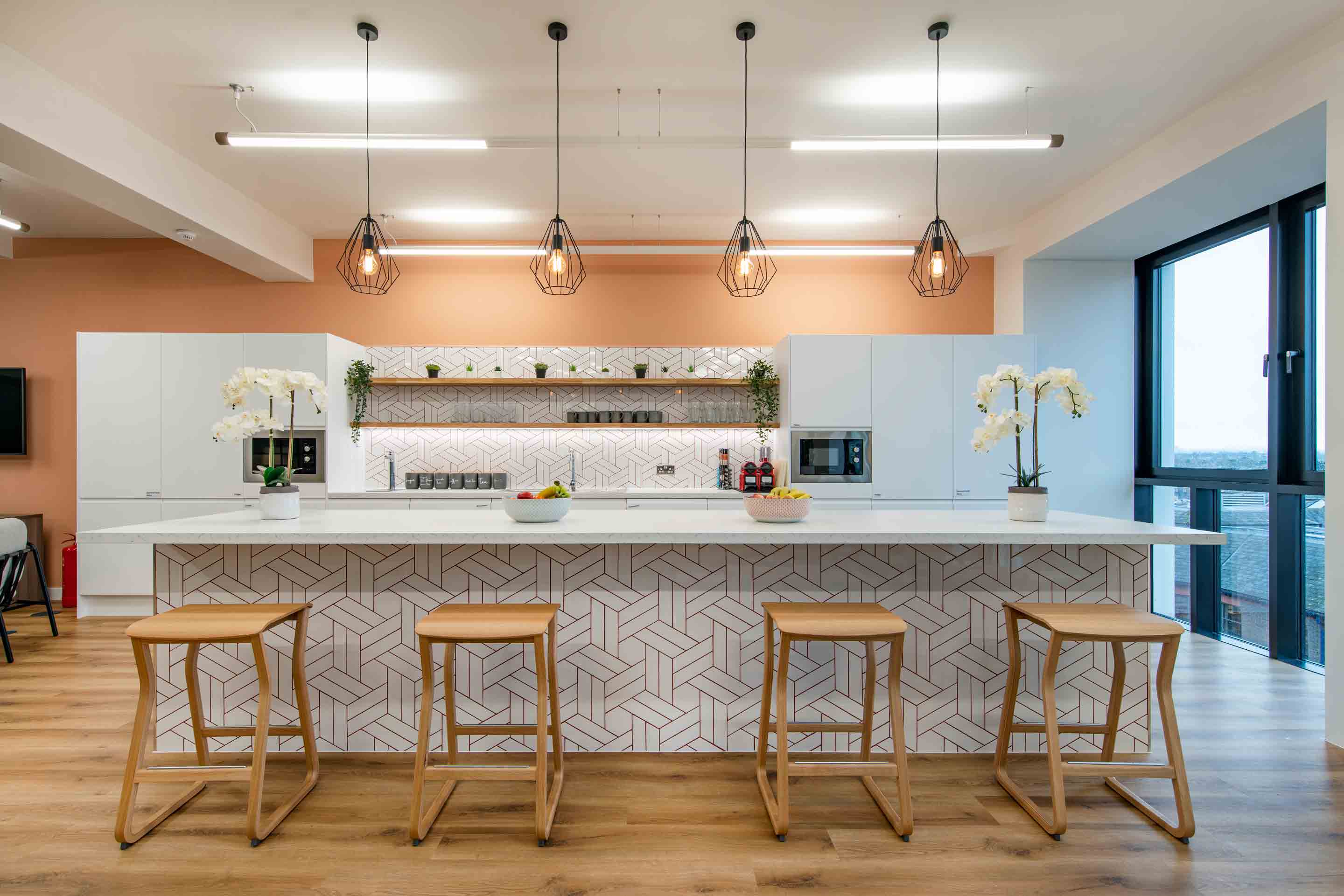 kitchen tea point with bar stools and breakfast bar