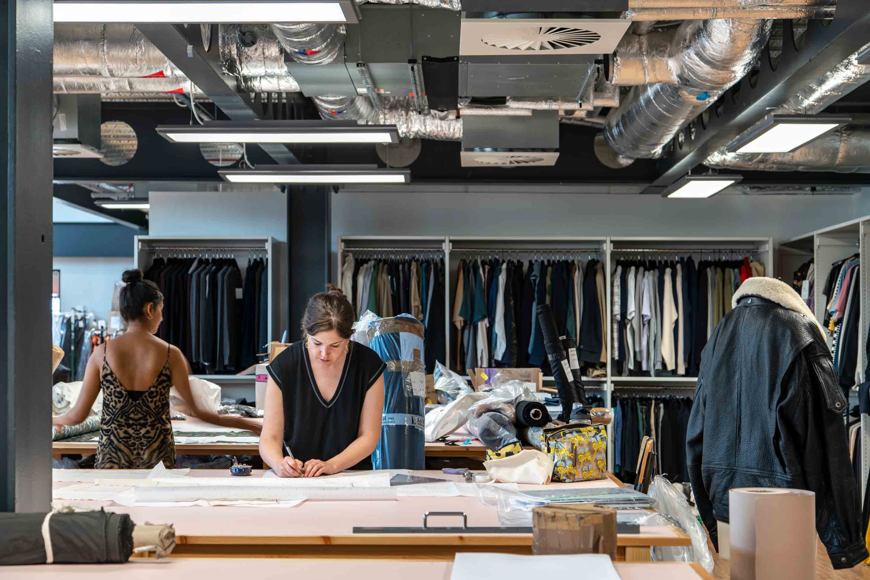 multipurpose workspace with wardrobe storage and women working