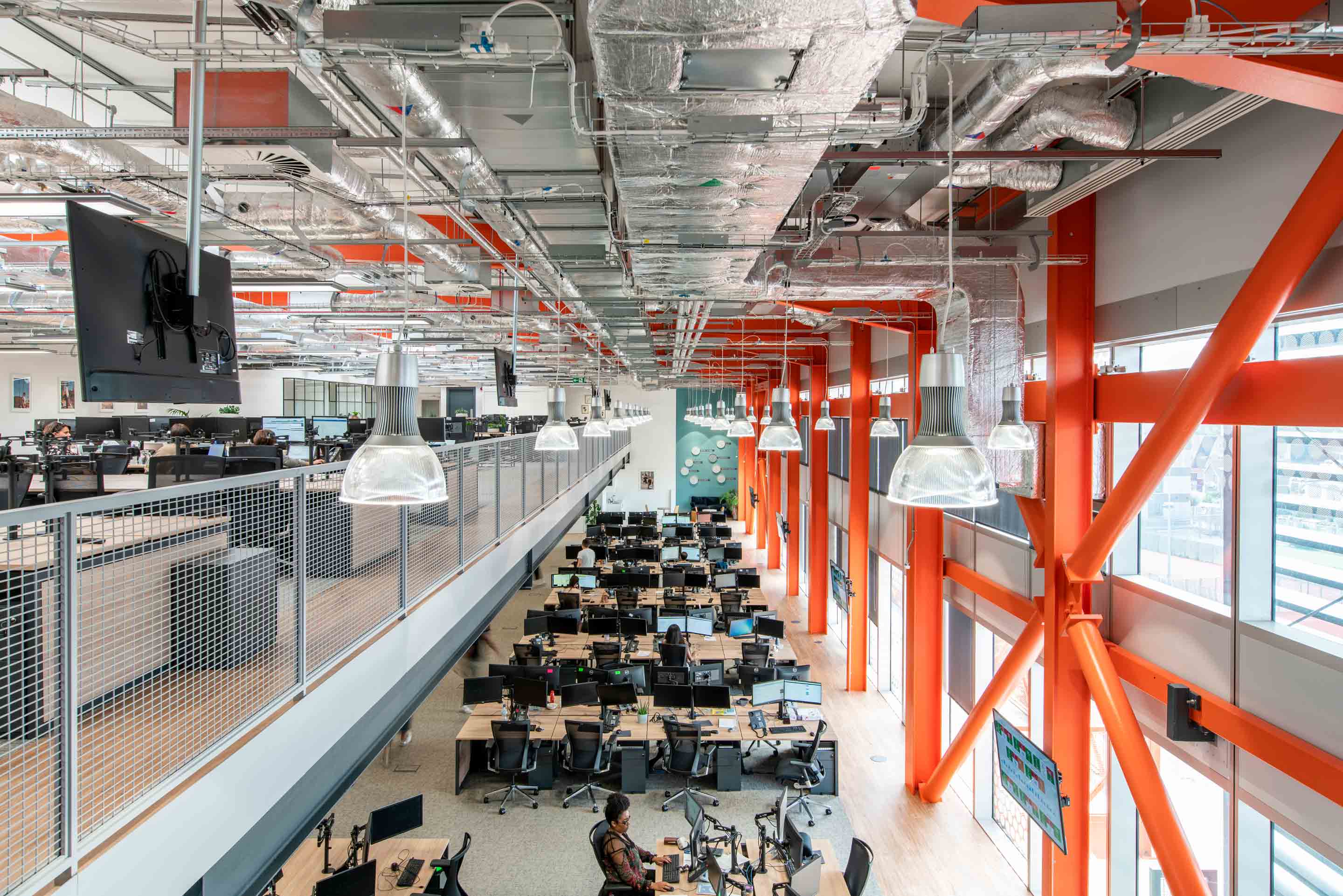 mezzanine split level desk space with dual screens and natural light