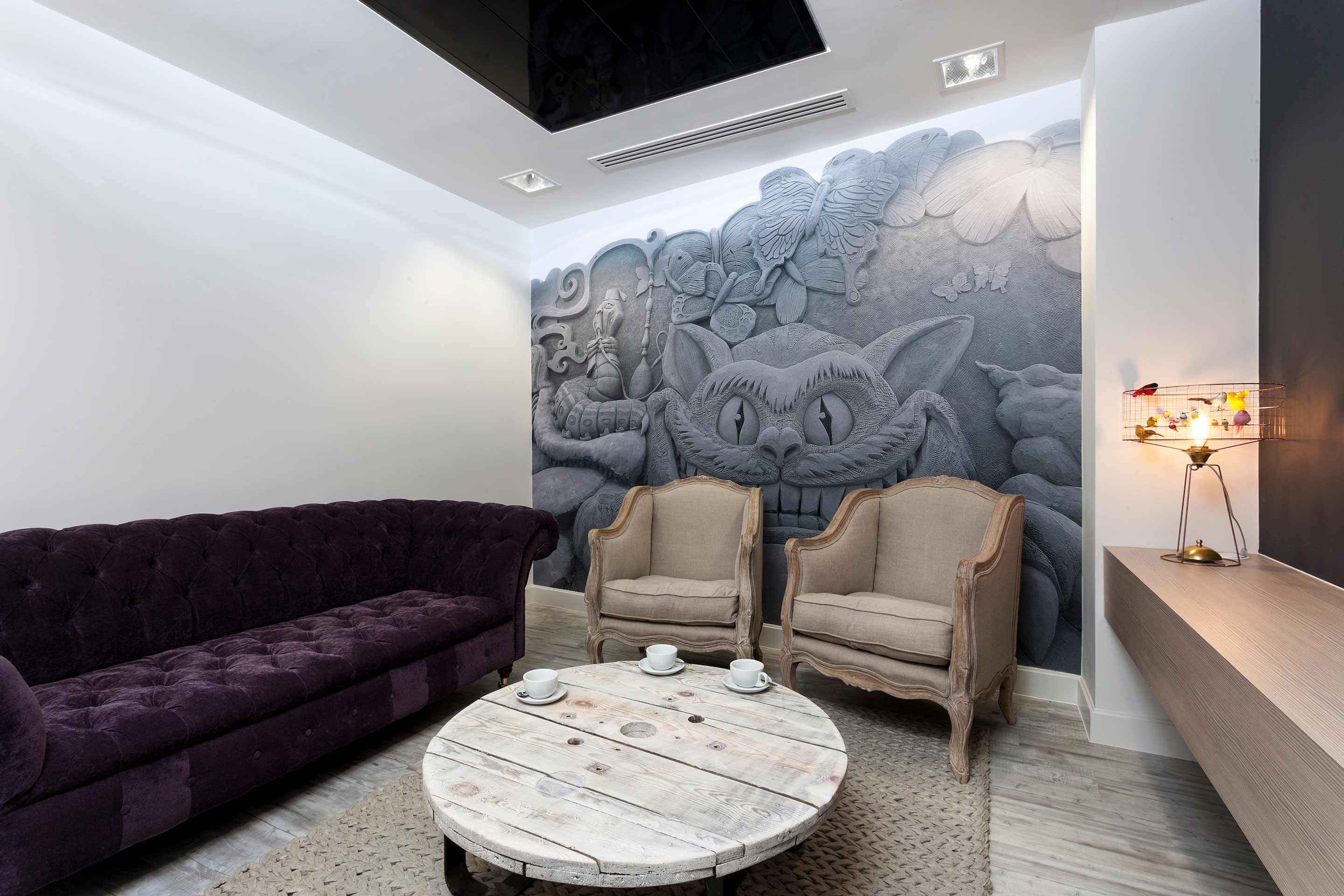 Meeting room featuring Cheshire Cat themed manifestations