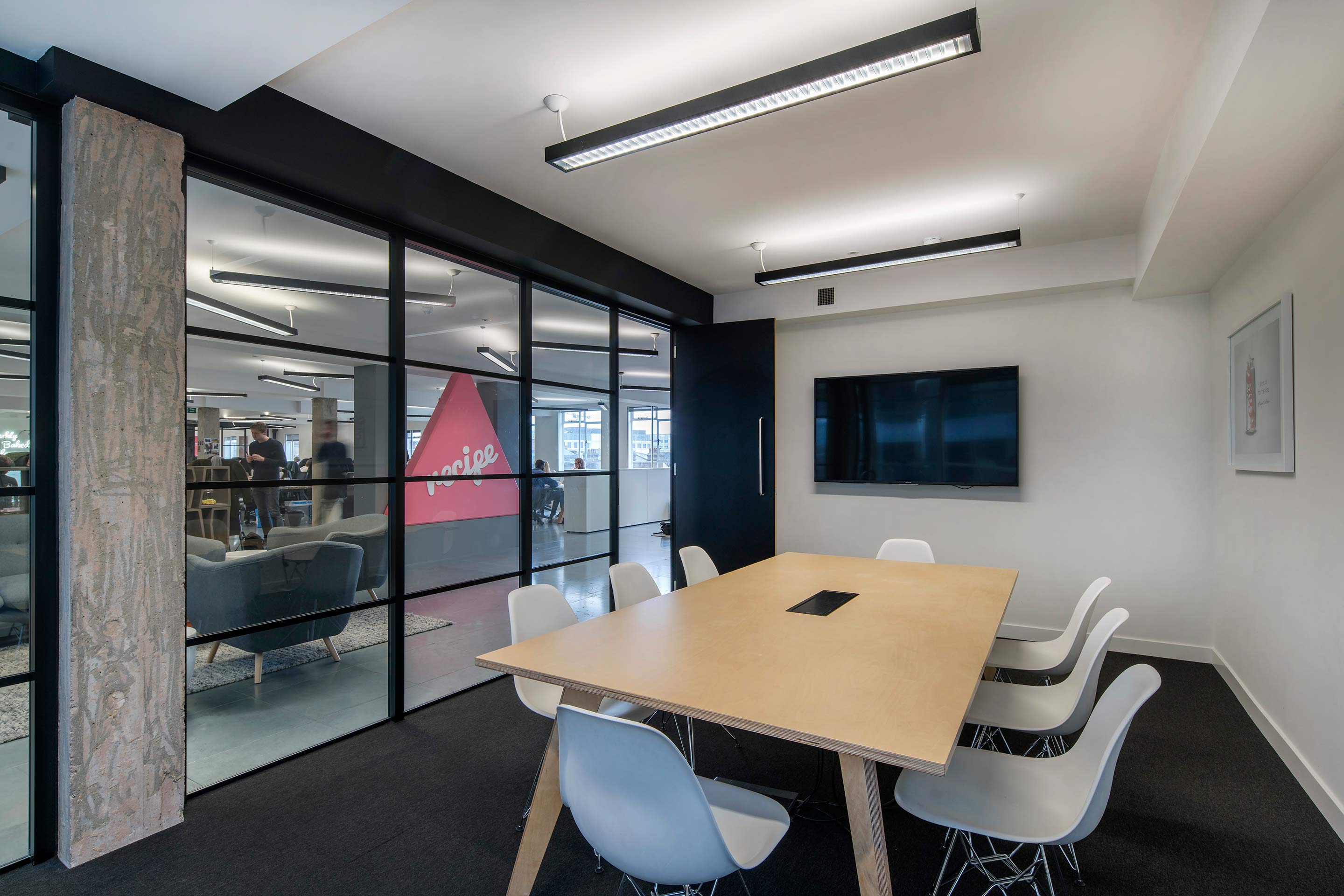 Meeting room with light wooden table