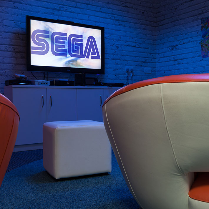 Game consoles in SEGA's social space and breakout area