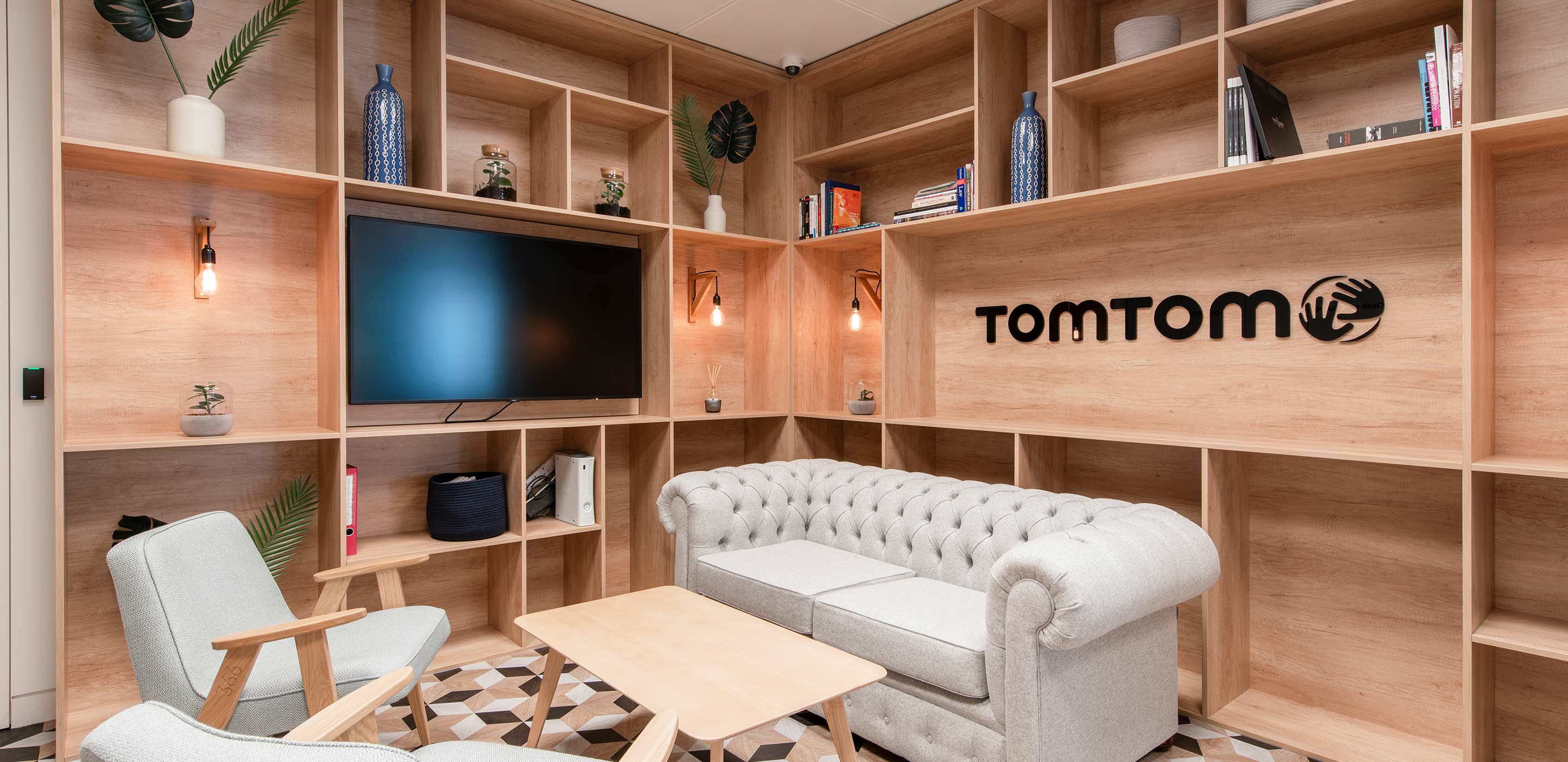 Office meeting room with shelves, soft seating and mood lighting