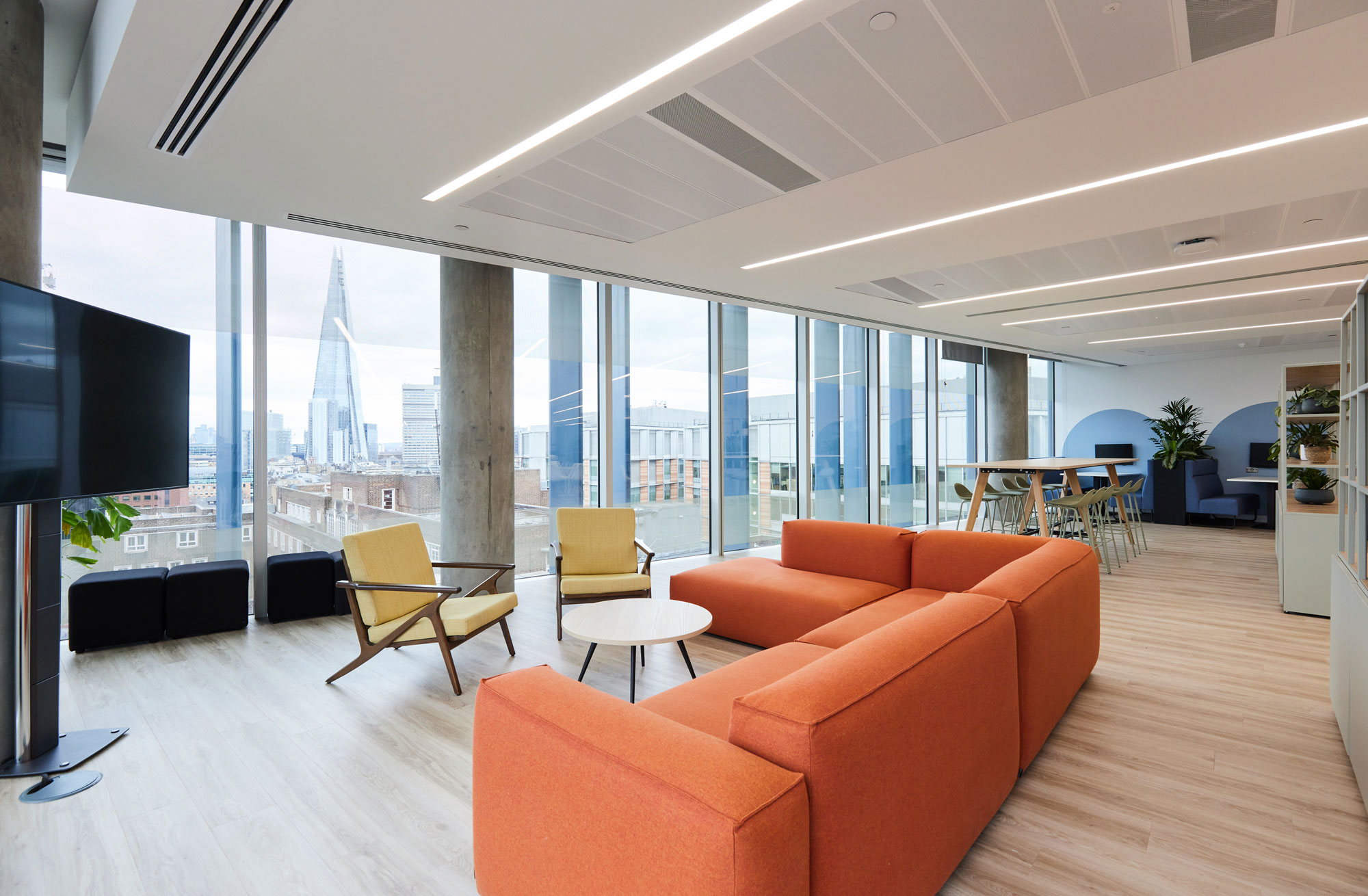 Soft seating in a social office space with panoramic views of the shard