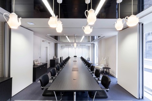 A large meeting and boardroom featuring suspended lighting