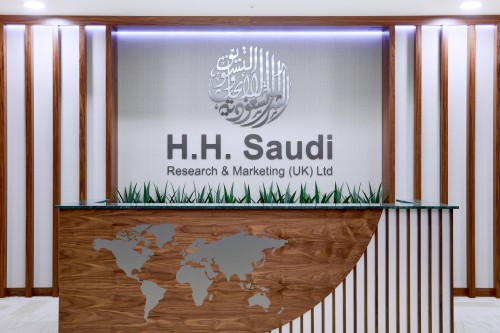 Front desk set below H.H. Saudi's logo