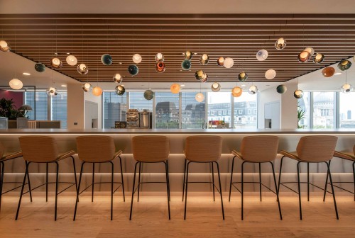 Unique lighting feature suspended over seating