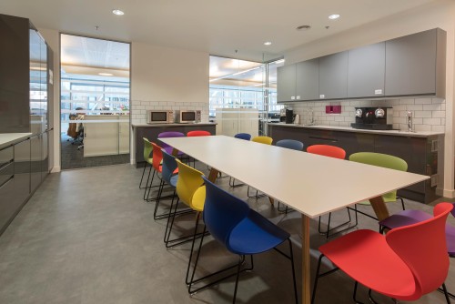 Brightly coloured seating in STR's kitchen and tea point
